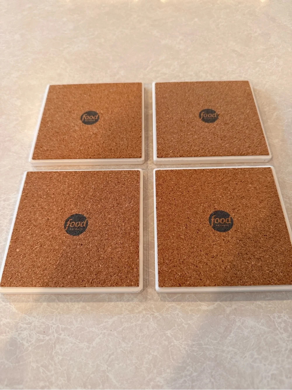 Food Network White Coasters with Black L and Orange, Blue, Green, Yellow Bands
